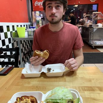 Sliders Burger - Max Liske still enjoying his 6oz burger and watching the game! He doesn't like sports though. - Burgers Near Me - San Jose, California Sliders Burger - Max Liske still enjoying his 6oz burger and watching the game! He doesn't like sports though. - Burgers Near Me - San Jose, California