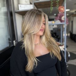 Desiree at Hairology - Luxury balayage with seamless dimension, bright money piece, and 90s face-framing layers for soft volume and an effortlessly polished finish