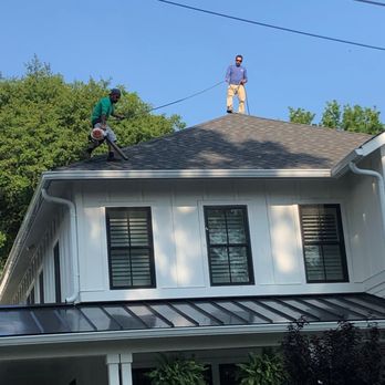 Green Machine - a man standing on top of a roof - Landscaping Near Me Green Machine - a man standing on top of a roof - Landscaping Near Me