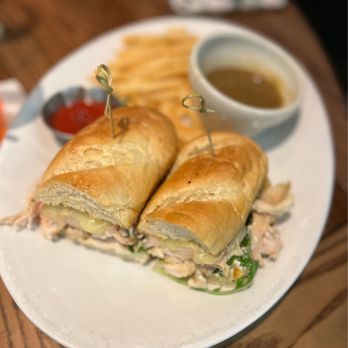 Chester's Kitchen and Bar - Famous Rotisserie Chicken Sandwich with fries - New American Near Me - Rochester, Minnesota