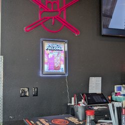 Rock N Roll Sushi - Wall at edge of bar.