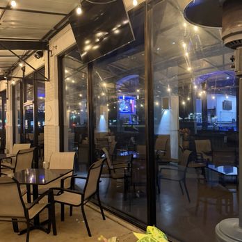 Andrew's American Pizza Kitchen - Inside patio seating through the window - Pizza Near Me - Plano, Texas Andrew's American Pizza Kitchen - Inside patio seating through the window - Pizza Near Me - Plano, Texas