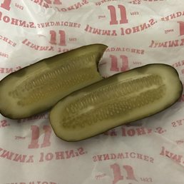 two pickles on a wrapper two pickles on a wrapper