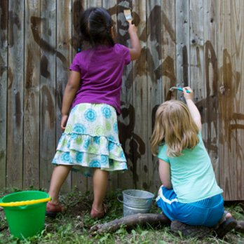 Peas In A Pod - Fun painting the wooden fence with water. Great pre-writing practice outdoors! - Child Care & Day Care Near Me - College Station, Texas Peas In A Pod - Fun painting the wooden fence with water. Great pre-writing practice outdoors! - Child Care & Day Care Near Me - College Station, Texas