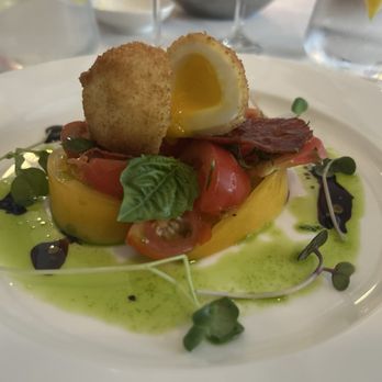 Bistro de Margot - Heirloom tomato salad with chorizo and a quail egg - French Near Me - Burlington, Vermont Bistro de Margot - Heirloom tomato salad with chorizo and a quail egg - French Near Me - Burlington, Vermont