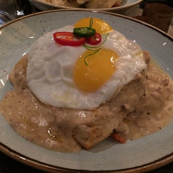 Yardbird - Biscuit & Gravy with a Crispy Chicken Thigh and Two Poached Eggs - Southern Near Me - Las Vegas, Nevada