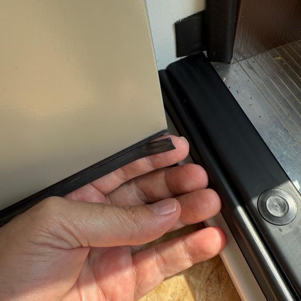 Opal Exteriors - Weather stripping flap torn/ripped. - Windows Installation Near Me - Naperville, Illinois