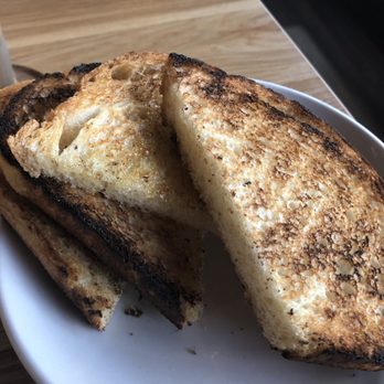 Broken Yolk Cafe - Side of sourdough. Slightly burnt. - Breakfast & Brunch Near Me - Costa Mesa, California