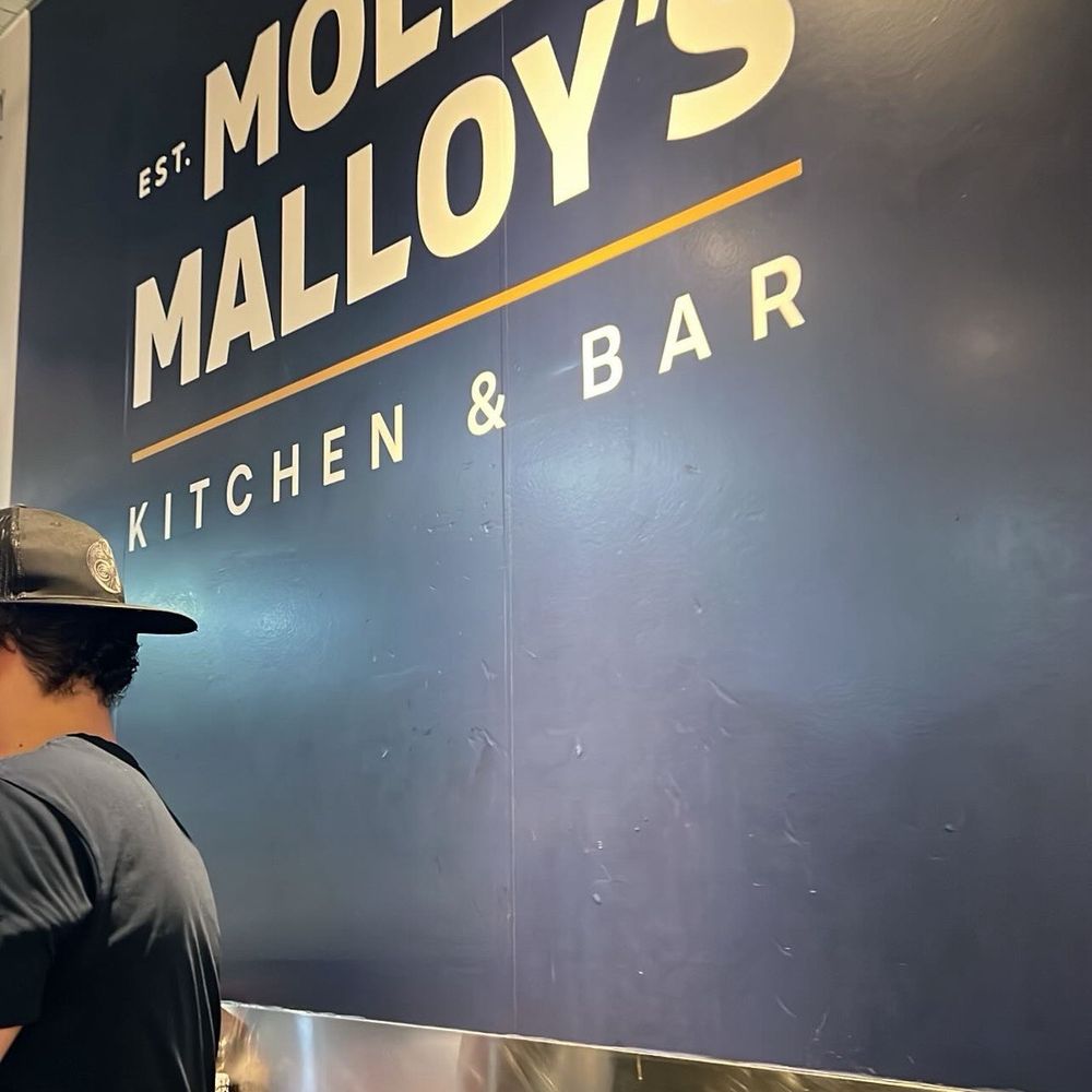 Molly Malloy's - Sign in front of the restaurant - Gastropubs Near Me - Philadelphia, Pennsylvania Molly Malloy's - Sign in front of the restaurant - Gastropubs Near Me - Philadelphia, Pennsylvania