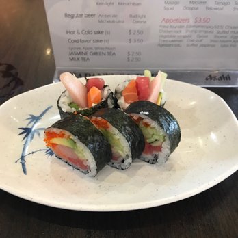 Asahi Sushi - Houston roll with part of the happy hour menu in the background lol - Sushi Bars Near Me - Houston, Texas