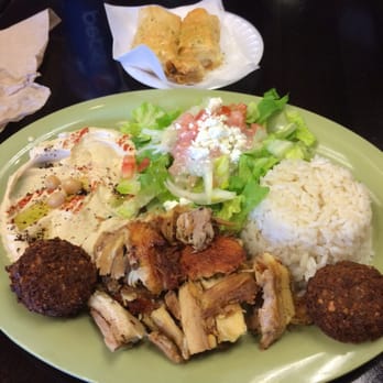 FelFel Mediterranean - chicken shawarma plate for $8- with white rice, Mediterranean salad, hummus, and falafels. baklava in the back. I love hummus! - Mediterranean Near Me - Denver, Colorado