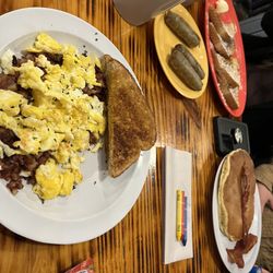 The Coop Chillicothe - Hash & Eggs, French Toast with Sausage, and a pancake stack with Bacon.