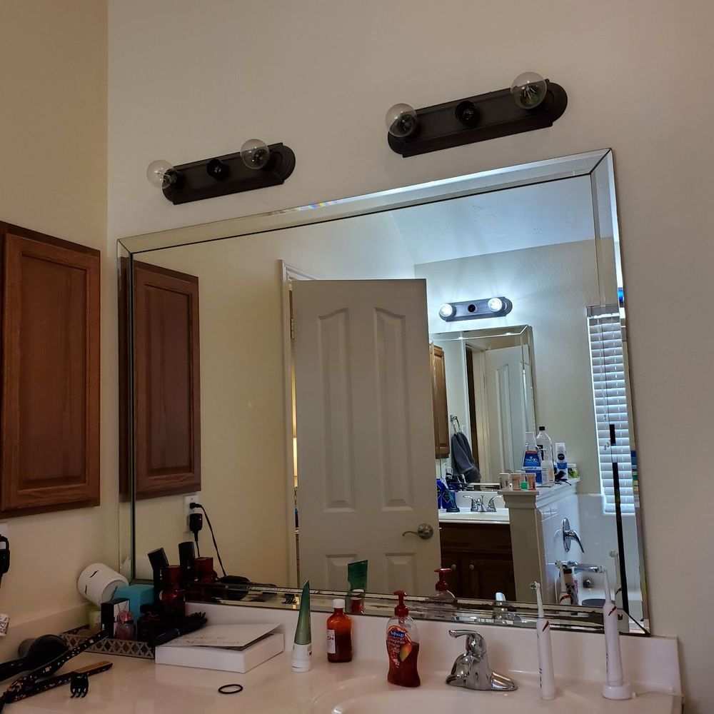 Miel Construction - a bathroom with a sink and mirror - General Contractors Near Me Miel Construction - a bathroom with a sink and mirror - General Contractors Near Me