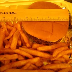 Big Easy Tavern & Cajun Cafe - Half Pound hamburger almost 5 inches wide! and those yummy fries.