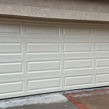 Apex Garage Door - New almond color garage door with steel and aluminum. Tom put a complementary moulding on the side of the frame to prevent water damage. - Garage Door Services Near Me Apex Garage Door - New almond color garage door with steel and aluminum. Tom put a complementary moulding on the side of the frame to prevent water damage. - Garage Door Services Near Me