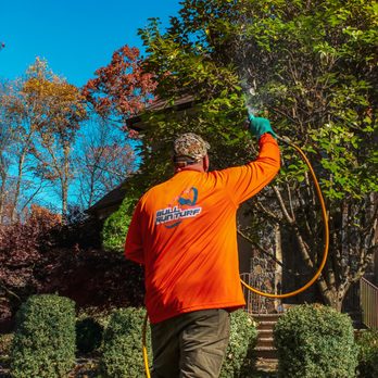 Bull Run Turf & Pest Control - a man in an orange shirt using a garden hose - Pest Control Near Me - Chantilly, Virginia Bull Run Turf & Pest Control - a man in an orange shirt using a garden hose - Pest Control Near Me - Chantilly, Virginia