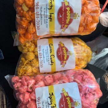 The Poppin Box - Our selection of popcorn! Signs were switched but still all tasted good! - Popcorn Shops Near Me - St Johns, Florida