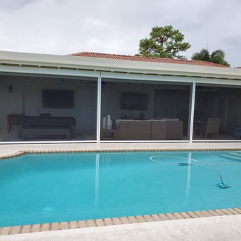 Harrison Awnings - Motorized Insect Screens with white frames and black No-See-Um screen material in Boca Raton - Awnings Near Me Harrison Awnings - Motorized Insect Screens with white frames and black No-See-Um screen material in Boca Raton - Awnings Near Me