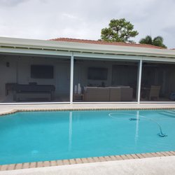 Harrison Awnings - Motorized Insect Screens with white frames and black No-See-Um screen material in Boca Raton