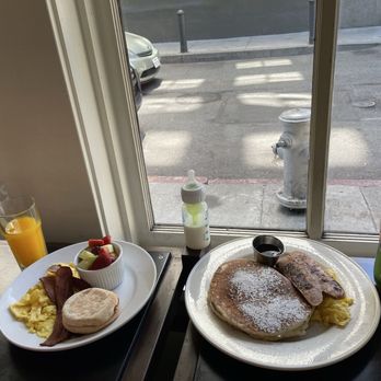 Mo'z Cafe - Mo'z Pancake Combo (left)  Basic Breakfast (right)  Fresh Squeezed Orange Juice Milk  Snapple - Breakfast & Brunch Near Me - San Francisco, California