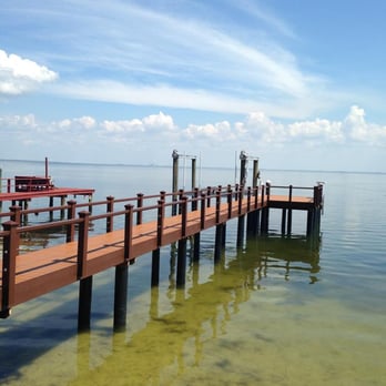 Coastal Construction - a wooden pier in the middle of a body of water - General Contractors Near Me - Clearwater, Florida Coastal Construction - a wooden pier in the middle of a body of water - General Contractors Near Me - Clearwater, Florida