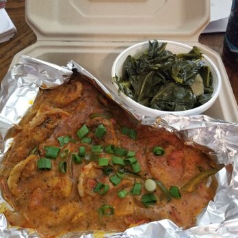 The Blue Hen Cafe - Cajun shrimp and grits with collard greens. - Southern Near Me - Saint Augustine, Florida