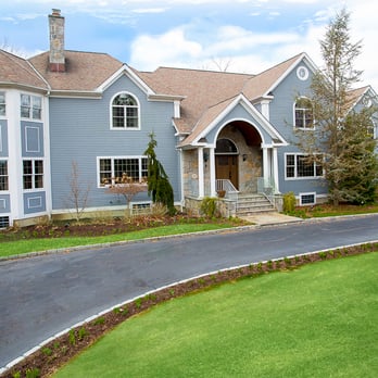 The Altamura Builders - a large house with a curved driveway - General Contractors Near Me The Altamura Builders - a large house with a curved driveway - General Contractors Near Me
