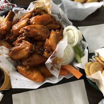 C & C Wings No 2 - a basket of chicken wings with a side of fries - Chicken Wings Near Me - Brownsville, Texas