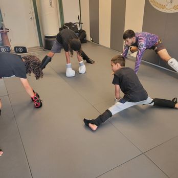 Champions Sol - Kids class starting with a warm up - Self-defense Classes Near Me - Long Beach, California