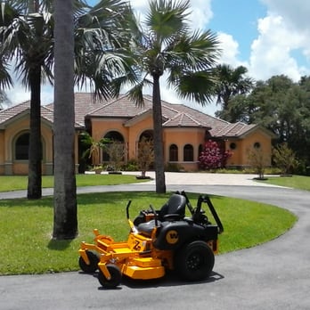 Sunstate Lawncare Services - a lawn mower in front of a house - Landscaping Near Me Sunstate Lawncare Services - a lawn mower in front of a house - Landscaping Near Me