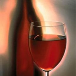 a glass of wine and a bottle
