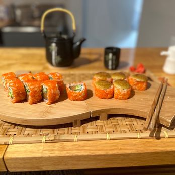 Sushi Zey - a sushi on a cutting board with chopsticks - Sushi Bars Near Me - Miami, Florida Sushi Zey - a sushi on a cutting board with chopsticks - Sushi Bars Near Me - Miami, Florida