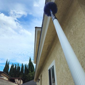 HomeShield Pest Control - Windows, roof and gutters being treated - Pest Control Near Me