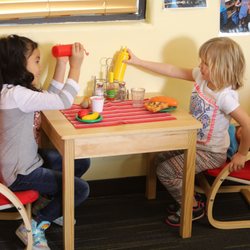 Kids enjoy imaginary play during open play.