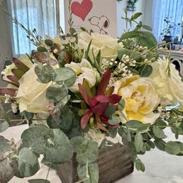 Flower arrangement in wooden box