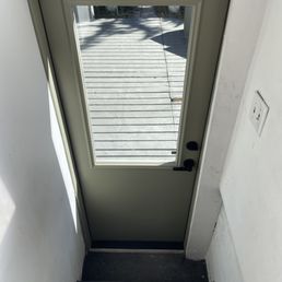 This is the non-standard pre-hung rear door, fiberglass with a half window. (Pardon the dirty walls. The house is a work in progress.)