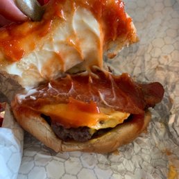 Should be two patties with more than a strip of bacon.... Should be two patties with more than a strip of bacon....