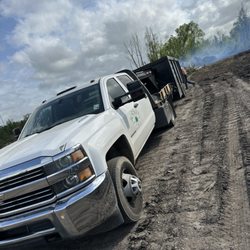 Borskey Tree Service - Flatbed truck used to haul tools and equipment such as saws, rope, dump trailer and others.