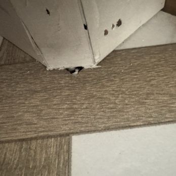 Promedia - Holes in tile and look at the installation in baseboards - Flooring Near Me - Chino, California