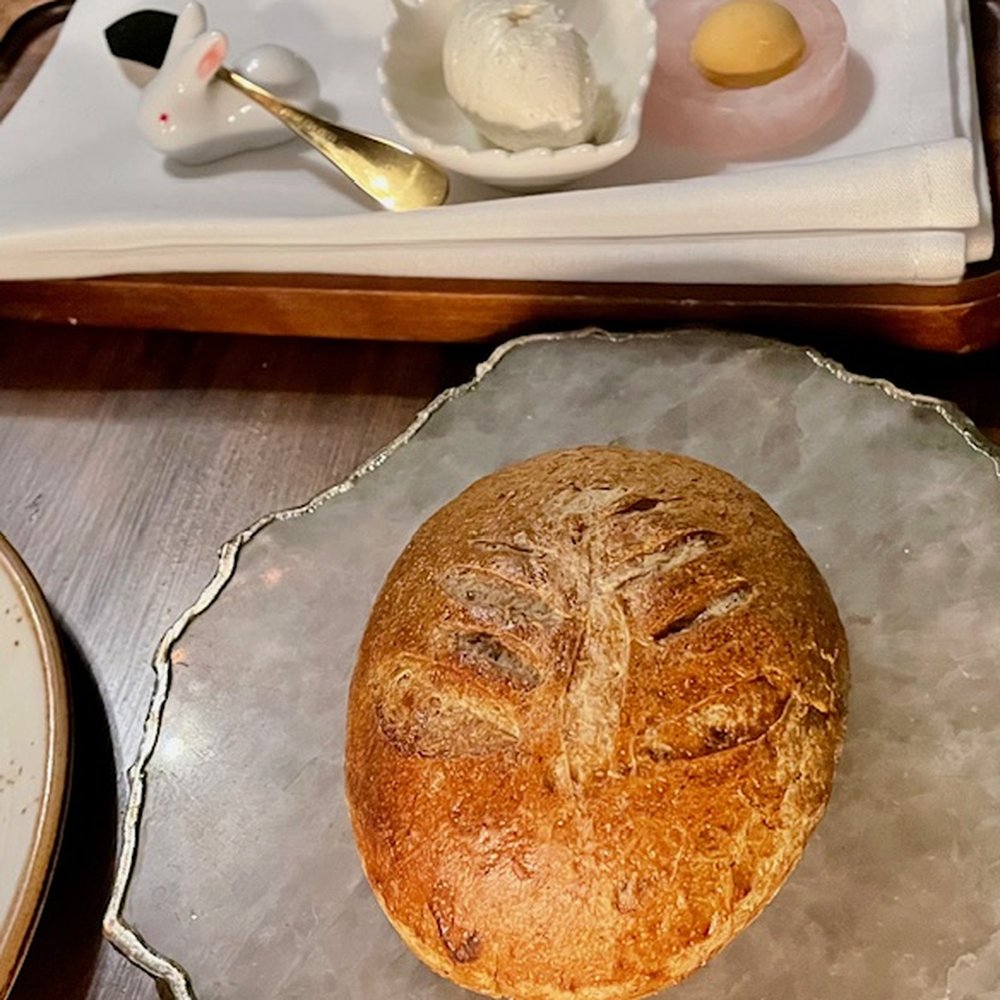 Just look at that adorable bunny holding the butter knife! And this delicious bun is infused with pine.
