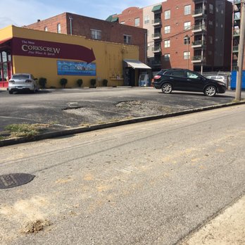 The Corkscrew - a city street with cars parked on the side of the road - Beer, Wine & Spirits Near Me - Memphis, Tennessee