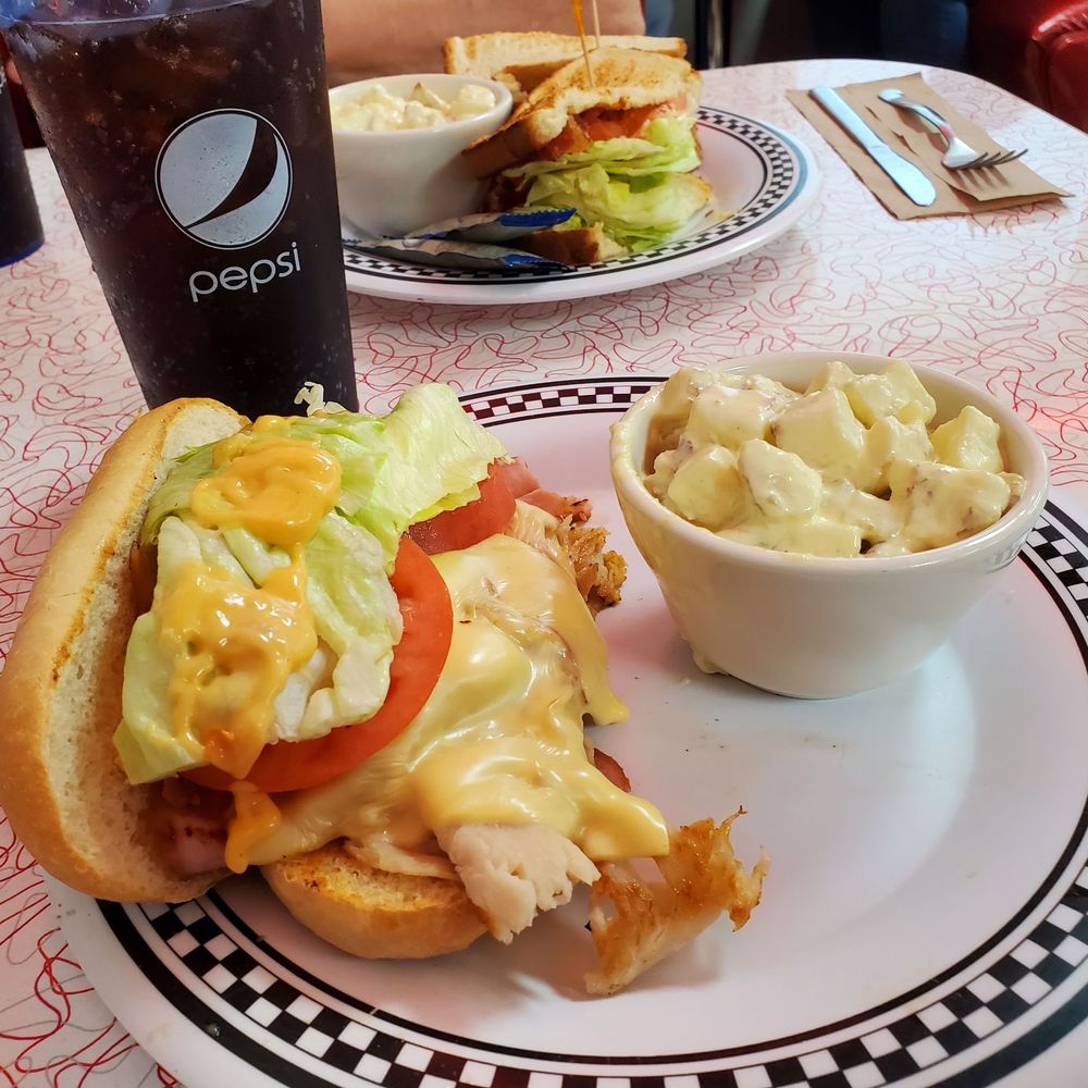 Charlie Parkers - Slim Kim w/potato salad and BLT in the background. - Diners Near Me - Springfield, Illinois