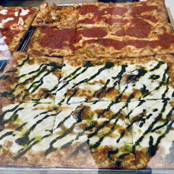 Stone's Pizza Shop - 3/26/26 - an assortment of square pizzas in the case - Pizza Near Me - Wappingers Falls, New York Stone's Pizza Shop - 3/26/26 - an assortment of square pizzas in the case - Pizza Near Me - Wappingers Falls, New York