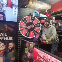This is Daquan at the wheel that customers can spin to receive a free gift.