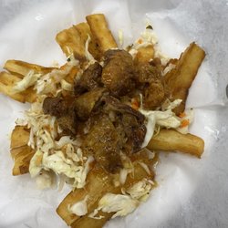 Pupusas y Antojos Salvadoreños Sandra - Yuca frita con chicarrones y curtido