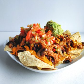 Planted in Hamilton - Loaded Nachos. BBQ jackfruit, grilled mushrooms and onions, cashew cheese sauce, red beans, salsa, guac. Nuff said. - Vegan Near Me - Hamilton, Ontario Planted in Hamilton - Loaded Nachos. BBQ jackfruit, grilled mushrooms and onions, cashew cheese sauce, red beans, salsa, guac. Nuff said. - Vegan Near Me - Hamilton, Ontario