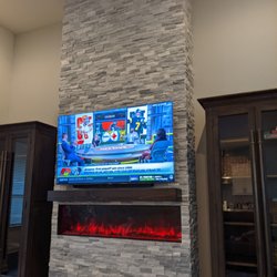 This entire fireplace was built on an empty wall.  The electric fireplace was sourced by our designer and really tops off the project.