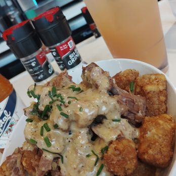 Ruby Sunshine Franklin - Breakfast Starter - Tater tots topped with Pork roast and creamy sauce - Breakfast & Brunch Near Me - Franklin, Tennessee Ruby Sunshine Franklin - Breakfast Starter - Tater tots topped with Pork roast and creamy sauce - Breakfast & Brunch Near Me - Franklin, Tennessee