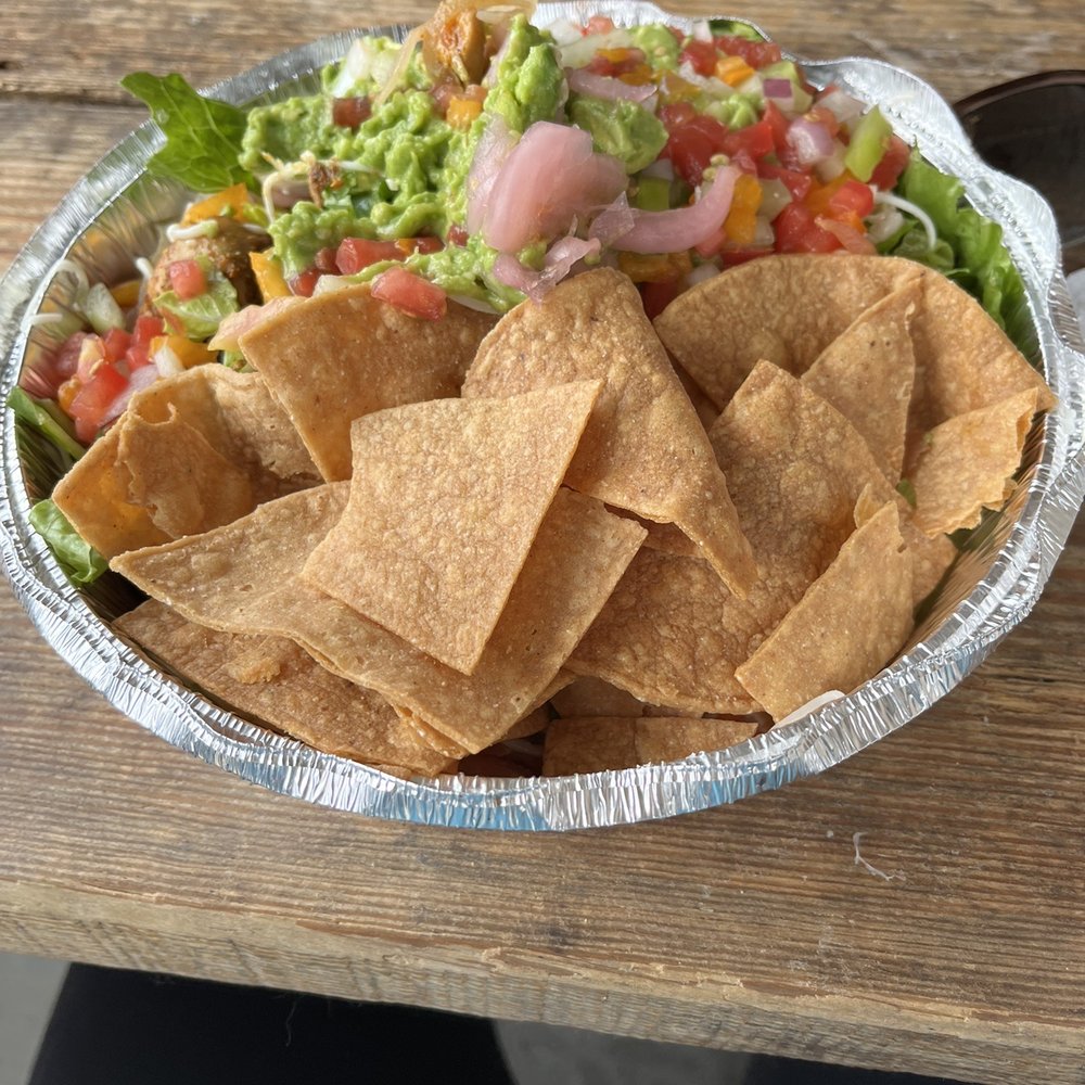 Chicken burrito bowl with lots of toppings including guacamole (big serving compared to most places). It's a lot of food! Chicken burrito bowl with lots of toppings including guacamole (big serving compared to most places). It's a lot of food!