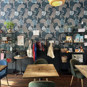 Cafe Con Carino - This wall is everything - Coffee & Tea Near Me - Oakland, California